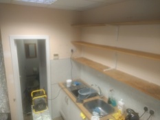 Walls a bit yellow, shelves in need of protection. Deeside Deli before it's freshen up.